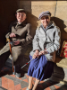 Eric and Vivienne enjoy the sunshine in the porch before the Thursday morning Communion